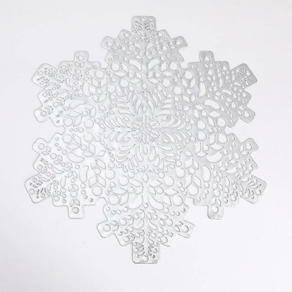 Snowflake-patterned heat-resistant placemats in gold and silver colors, ideal for holiday table settings and decor