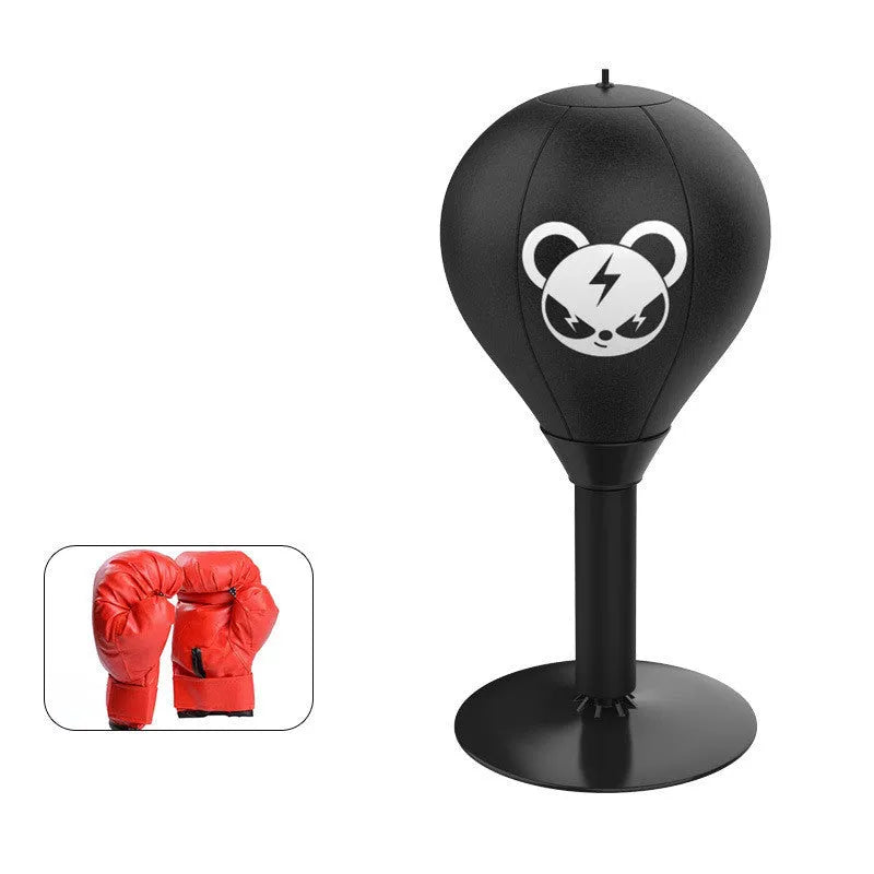 Tabletop boxing speed ball with suction cup base on a desk, showing burst bear design and flexible connection tube