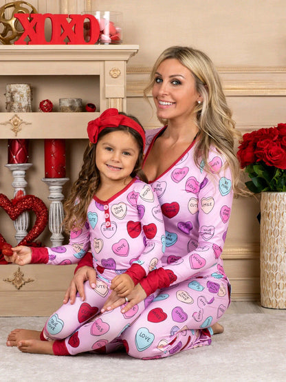 Adorable heart-printed family pajamas with long-sleeve tops and full-length bottoms in a range of sizes for children and adults.