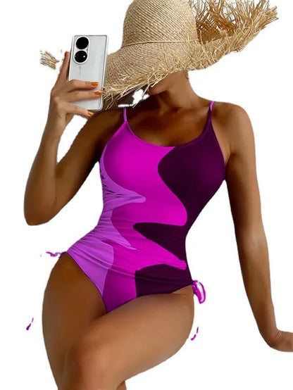 Women's sleeveless one-piece swimsuit in a striped print, shown in blue colour.