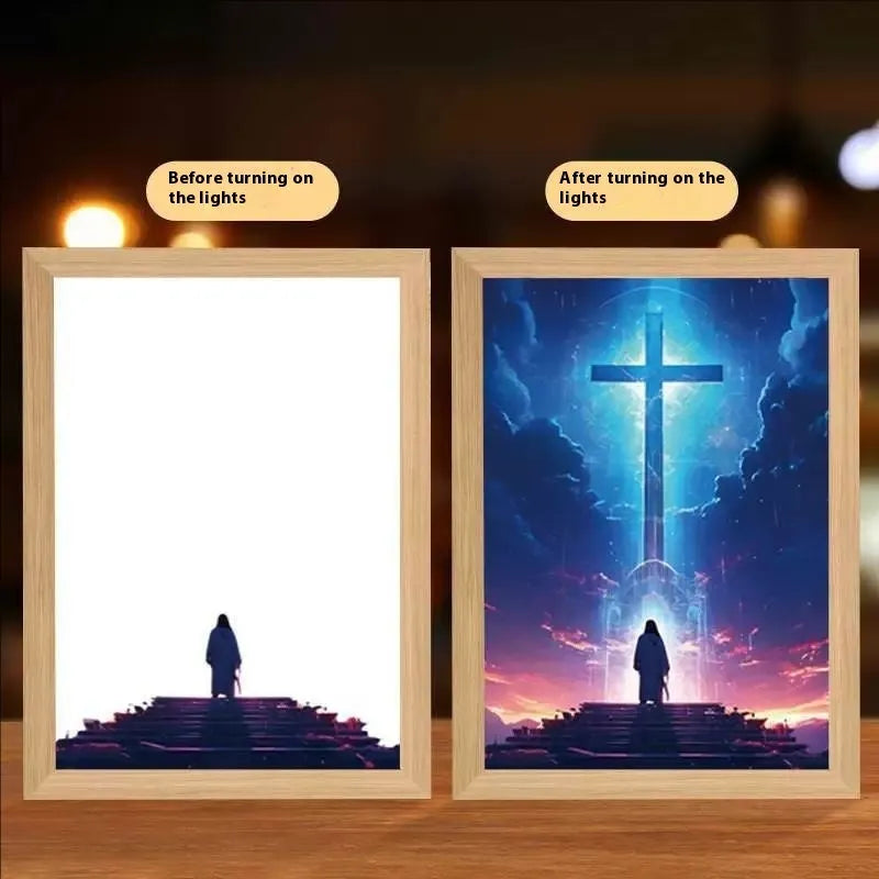 Modern rectangular light painting photo frame displaying an illuminated cross and scenic artwork.