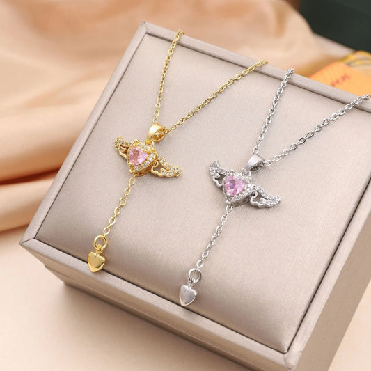 Elegant angel wings necklace with moving heart pendant, made of titanium steel and crystal accents