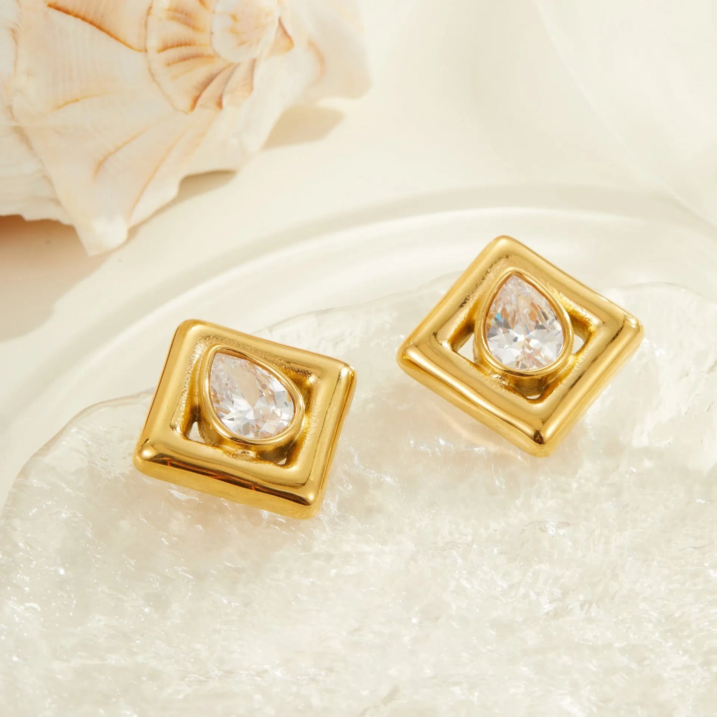 Gold geometric stud earrings with water drop zircon stones on stainless steel