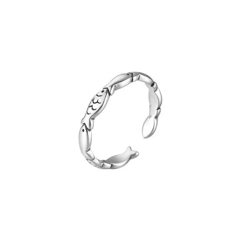 Women's adjustable sterling silver fish ring with detailed carp design on silver band