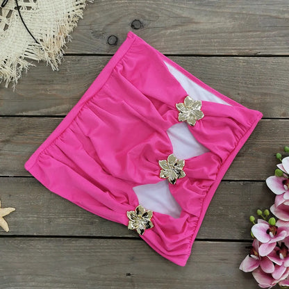 Women's solid colour one-piece swimsuit with detachable short skirt in a high-waisted, hollow-out tube top design.
