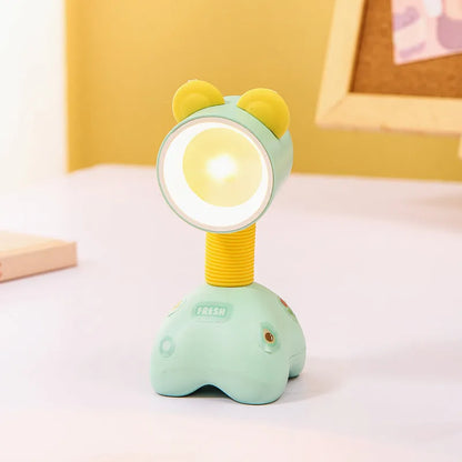 Colourful cartoon character magnetic DIY night light on a desk with adjustable head.