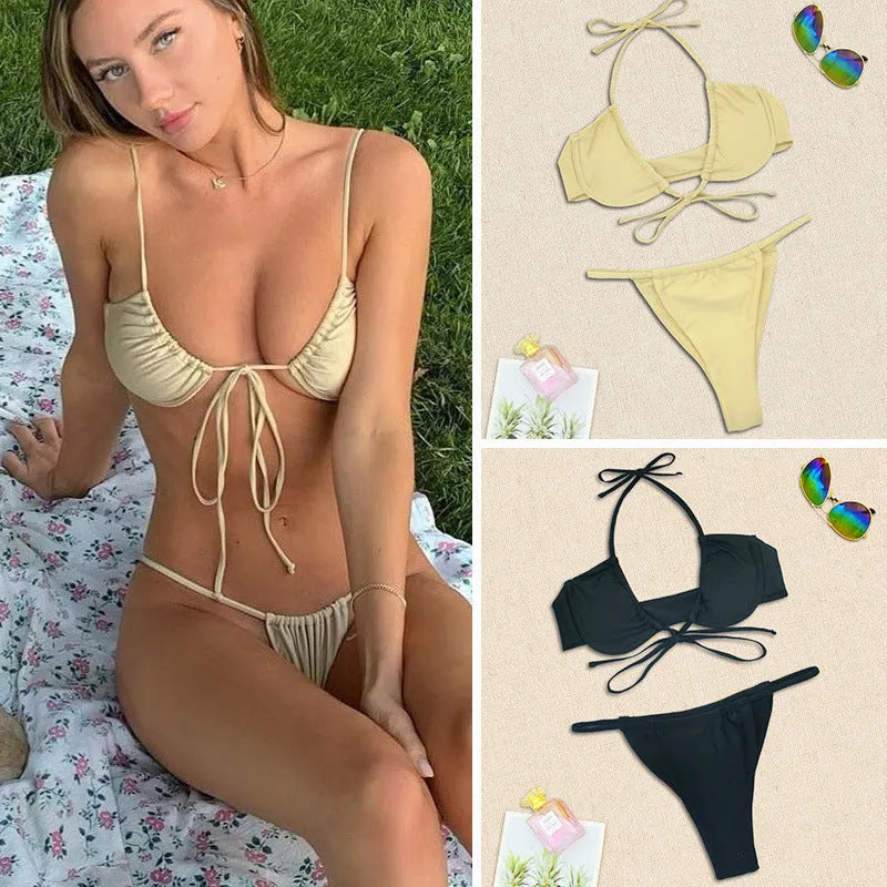 Women's black and mint green split-style bikini swimsuit made from nylon fabric.