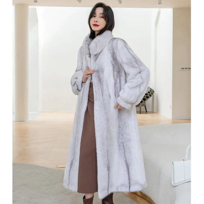 White faux fur women's winter coat with stand-up collar on a hanger