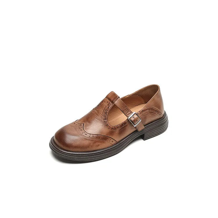 Women's black and brown round-toe flat casual shoes made from sheepskin leather.