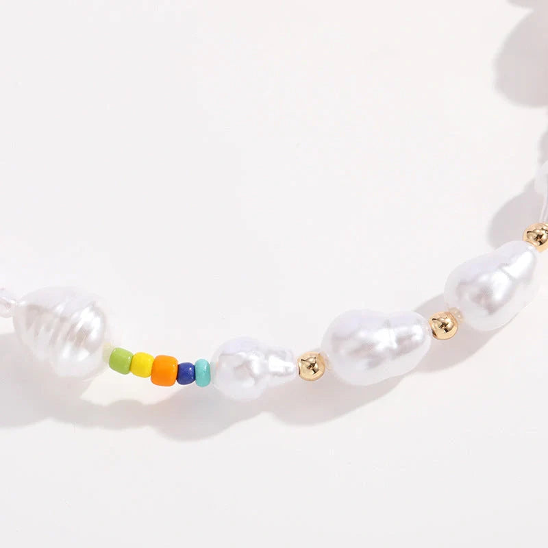 Elegant gold-plated necklace set featuring multi-row imitation pearl design, perfect for formal and casual wear
