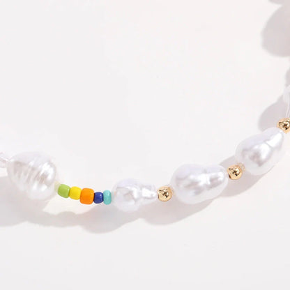 Elegant gold-plated necklace set featuring multi-row imitation pearl design, perfect for formal and casual wear