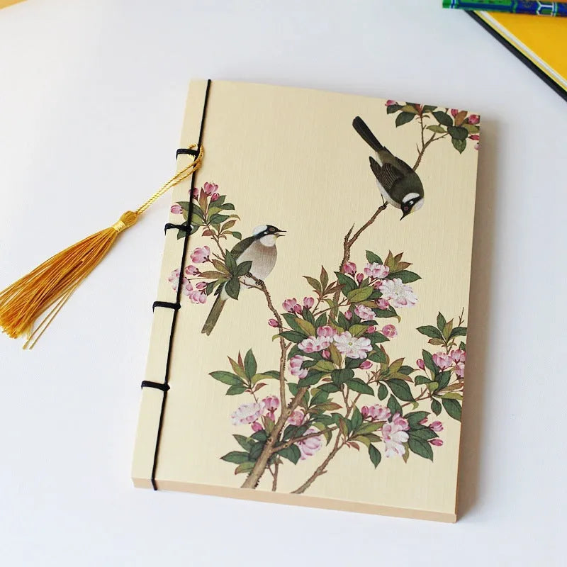A5 antique wire-bound notebook with classical artwork cover, black oil wax rope binding, and decorative tassels
