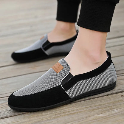 Men's grey canvas lace-up casual shoes with a round toe and rubber sole.