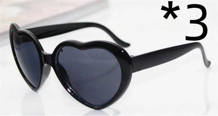 Fashionable heart-shaped light-up glasses with a built-in LED lighting system, perfect for adding a touch of love and playfulness to any occasion.