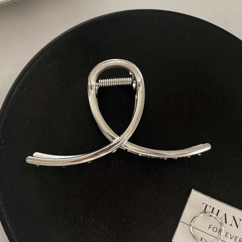 Silver metal hair claw barrette example from a range of 44 Korean-style designs.