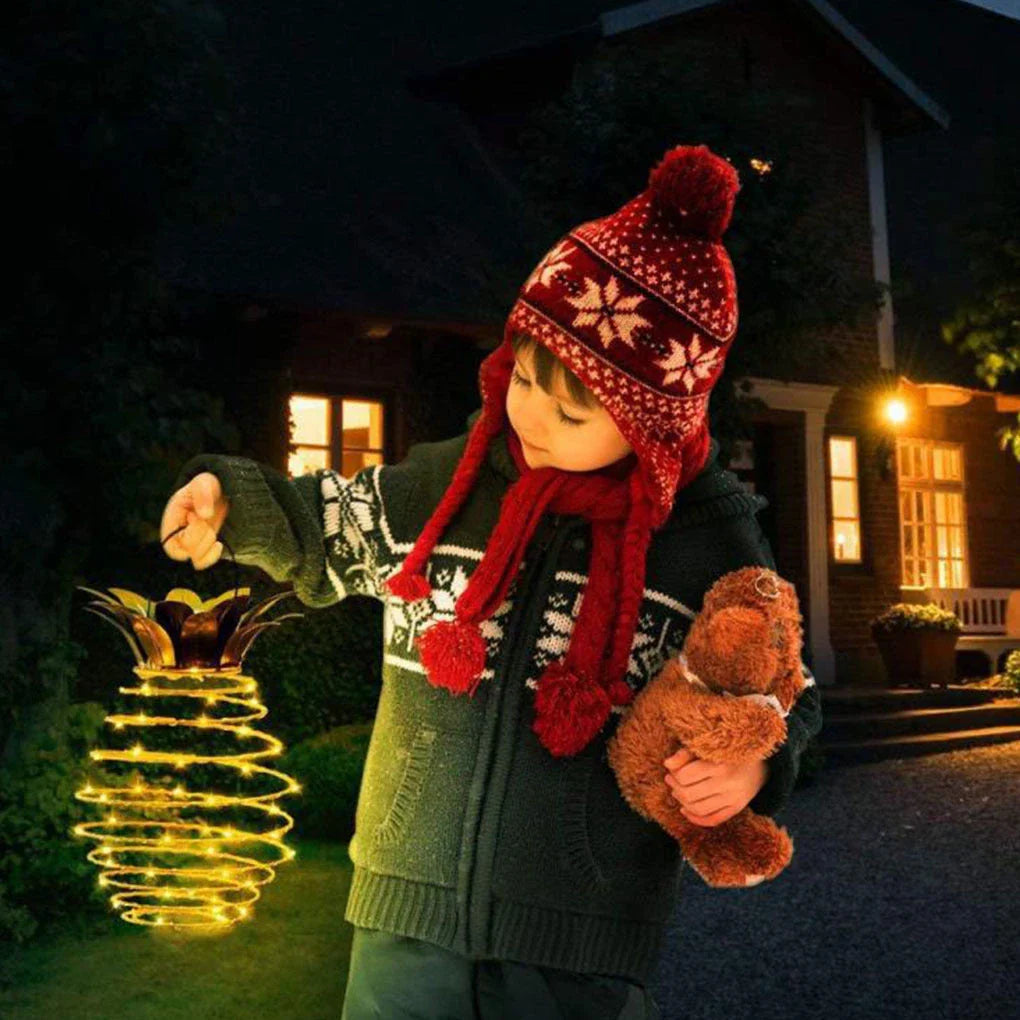 Solar-powered pineapple-shaped outdoor lights with a weather-resistant metal frame and warm white LED bulbs