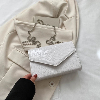 Clamshell handbag with crocodile pattern and soft handle in various colours