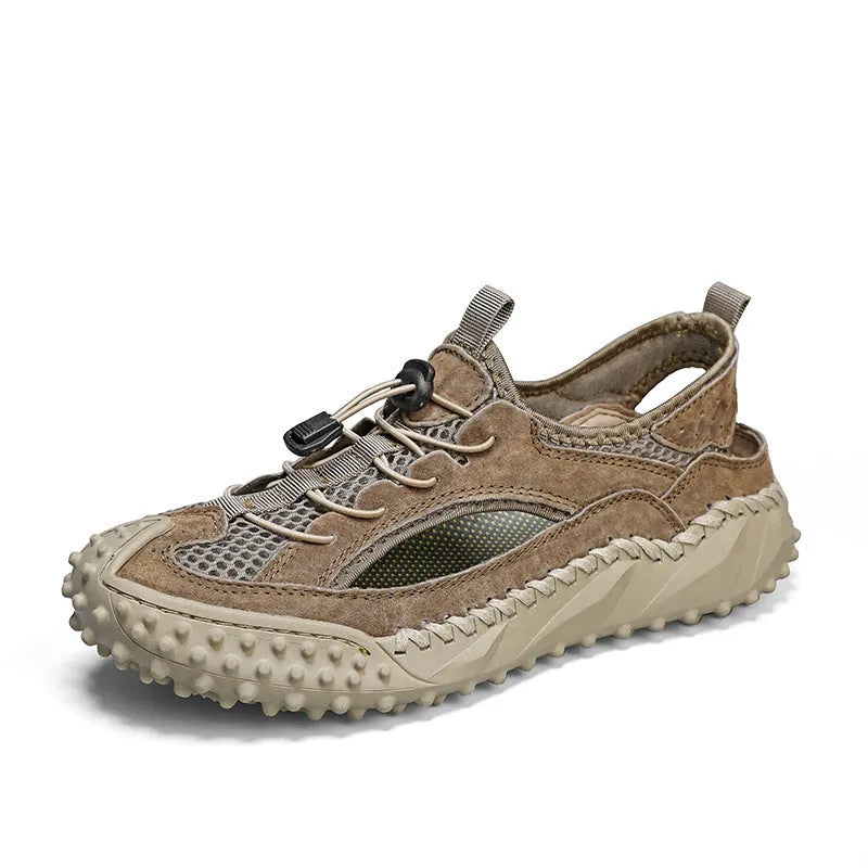 Men's black waterproof wading sandals with elastic band and perforated leather mesh upper on a rubber sole.