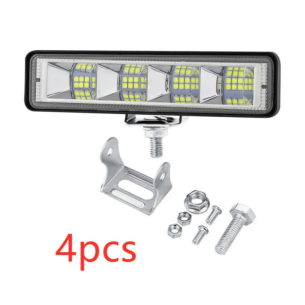 Four compact aluminium LED work lights in work light white colour, suitable for vehicle mounting.