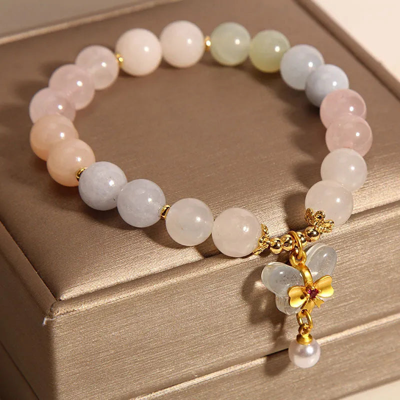 Original design women's bracelet with colourful morganite butterfly pendant made from crystal and jade.