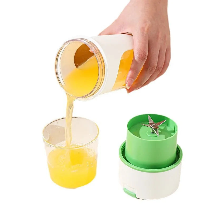 Blue portable USB rechargeable electric juicer blender with a large feed cap on a kitchen counter.