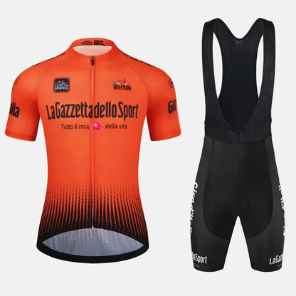 Close-up of a cyclist wearing a patterned quick-dry short sleeve cycling suit in a summer landscape.