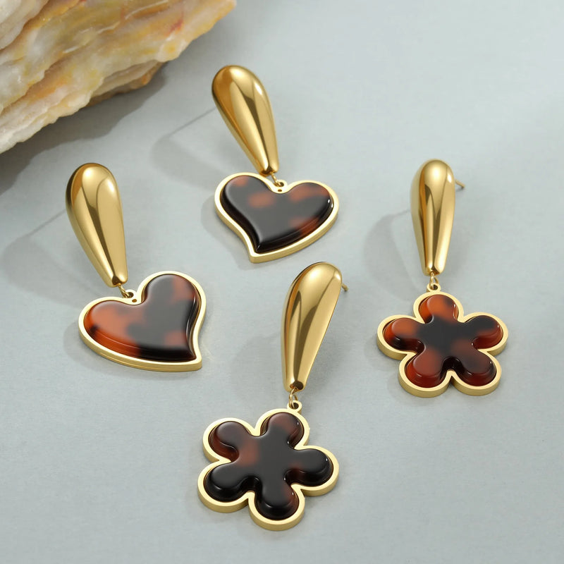 Stainless steel women's tortoiseshell resin earrings in 18K gold electroplated finish, available as heart-shaped or geometric floral designs with round and line elements, suitable for fashion-forward office wear, durable everyday jewellery option