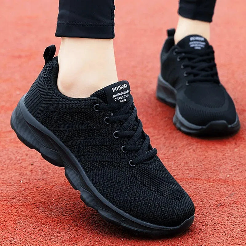 Women's leisure shoes with mesh fabric upper and breathable design for jogging, work, and travel, available in low-heel round-toe lace-up style with white, black, or black rose red colour options across sizes 35-43.