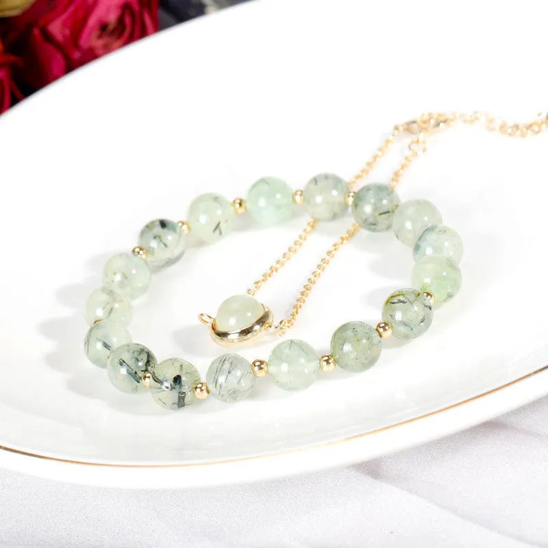 Double-layer women's bracelet with lucky beads and colourful crystals in gold-toned setting