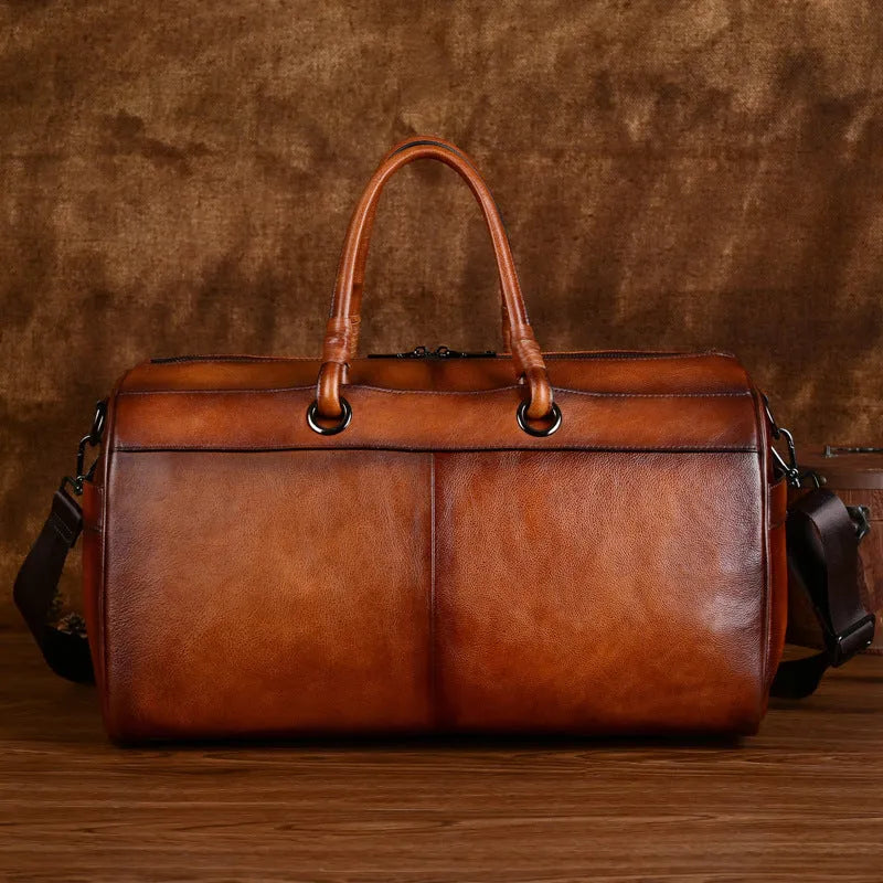 Handmade brown retro leather tote bag with large capacity for travel.