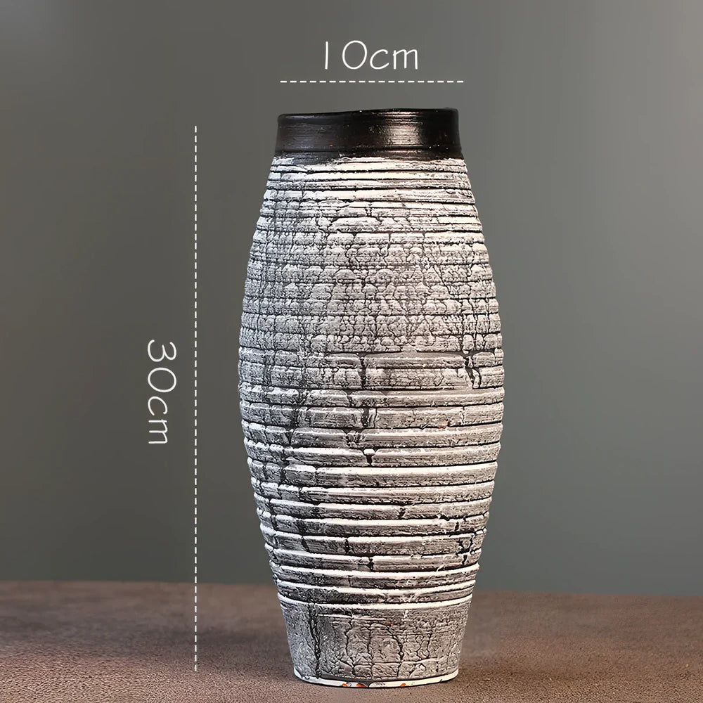Ceramic mosaic vase with dried flower arrangement, handcrafted surface detailing