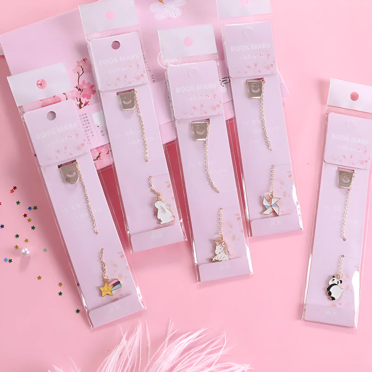 Alloy metal cartoon pendant bookmark with colourful charms including panda, rocket, and wishing bottle designs