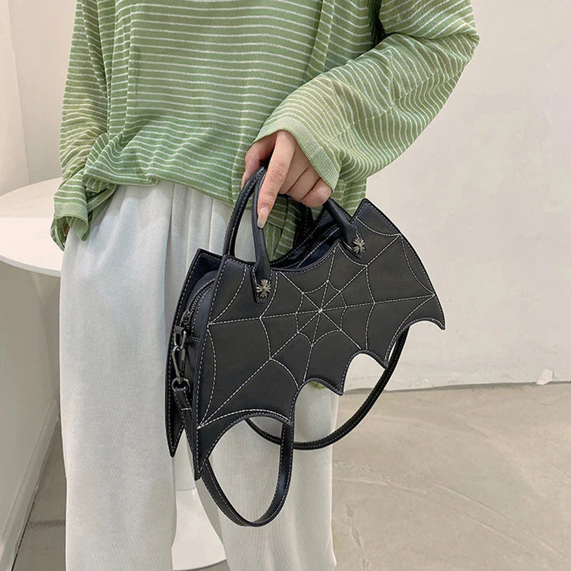 A stylish Halloween shoulder bag with a captivating spider web design, made of durable PU leather and offering ample storage space.