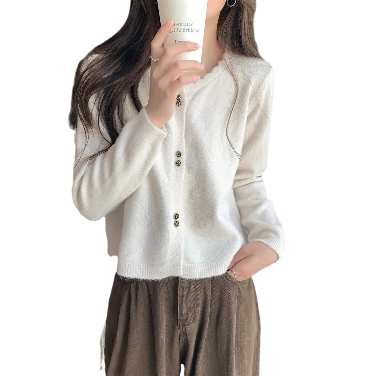 Women's milky white long sleeve acrylic cardigan sweater worn open, showing free size fit and regular sleeve design.