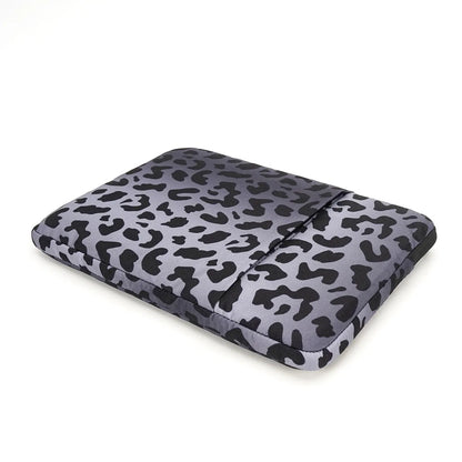 Leopard print laptop protective sleeve for 13 to 16 inch devices on a grey background