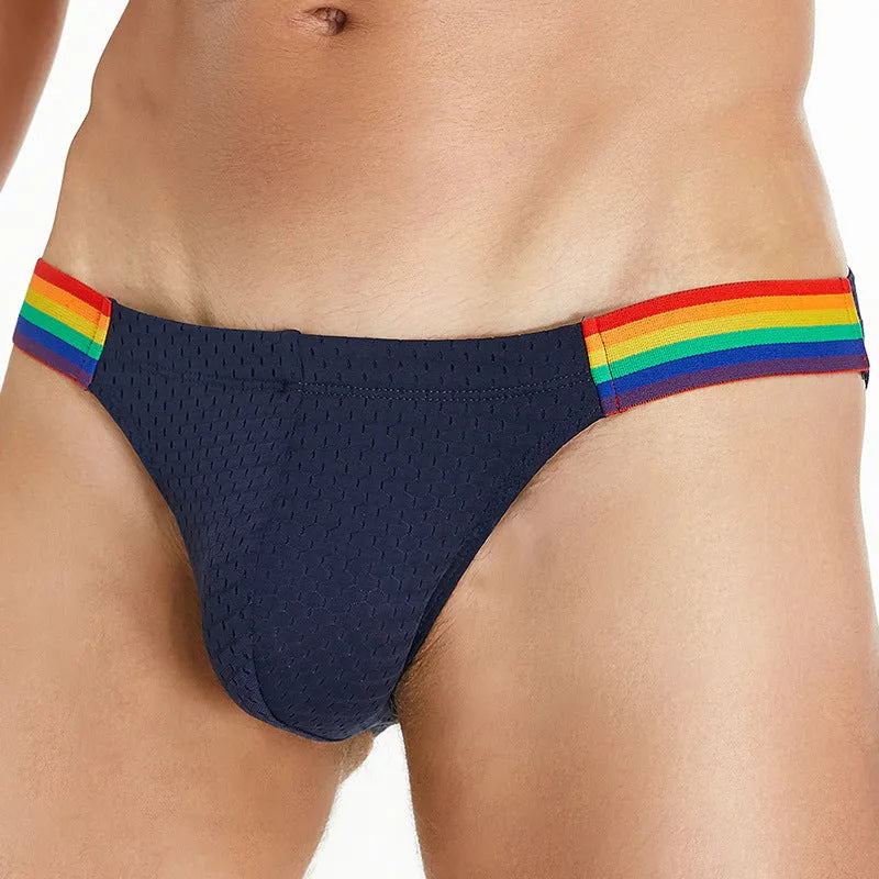 Men's black nylon mesh briefs with a low waist and multicoloured rainbow waistband