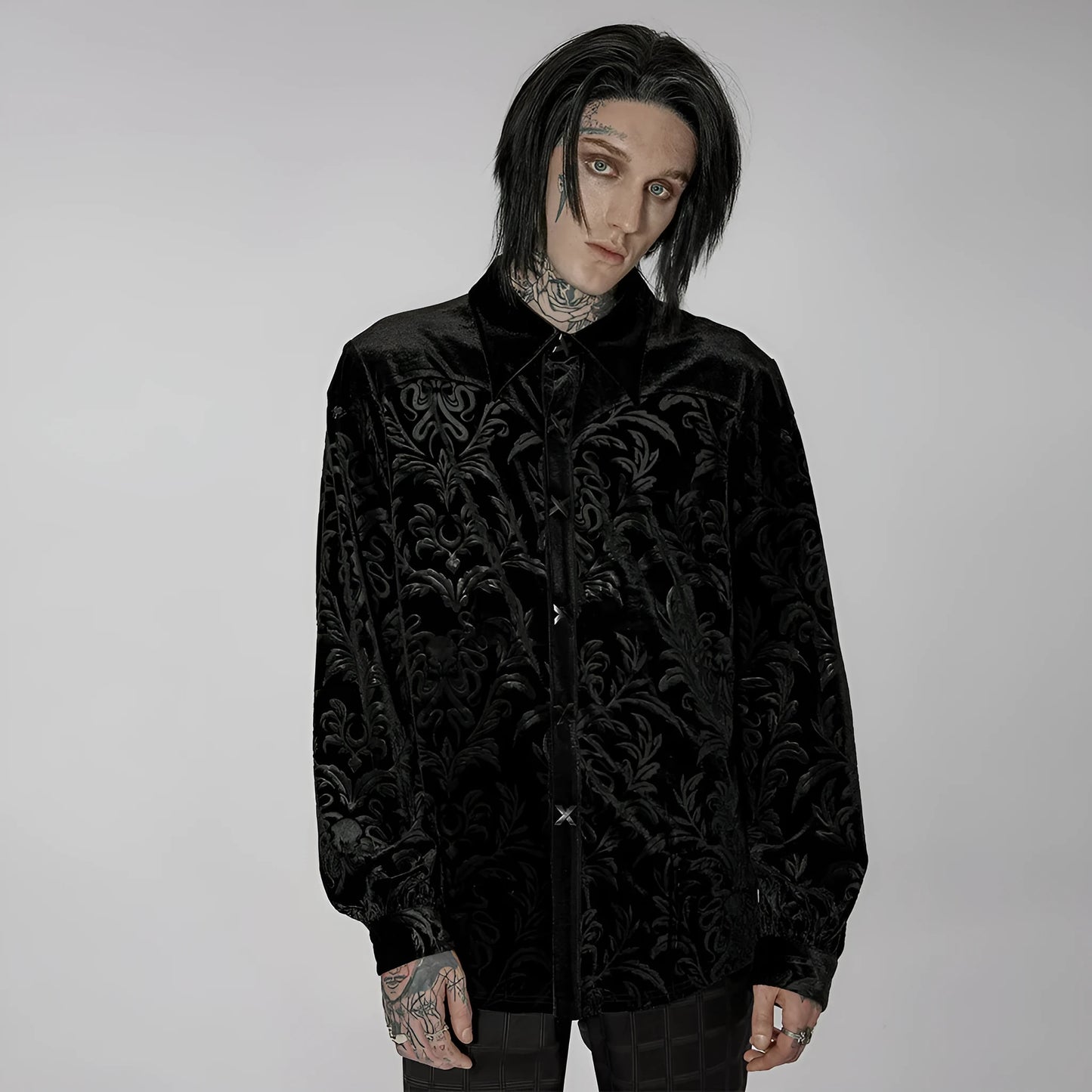 Black men's velvet shirt with pointed collar, long sleeves, and decorative printing and flocking fasteners.