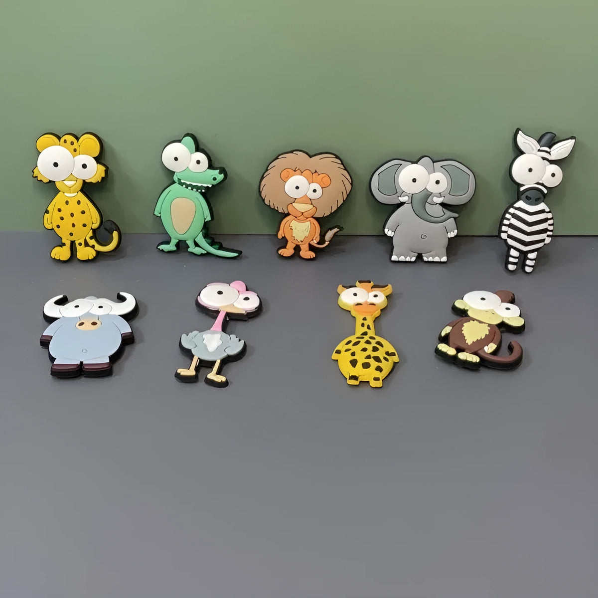 Nine PVC soft rubber cartoon animal fridge stickers including monkey, crocodile, leopard, lion, zebra, elephant, giraffe, and ostrich.