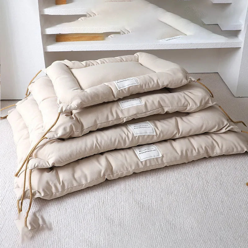 Beige cage cushion for dogs tied inside a metal crate, shown next to coffee and orange colour options.