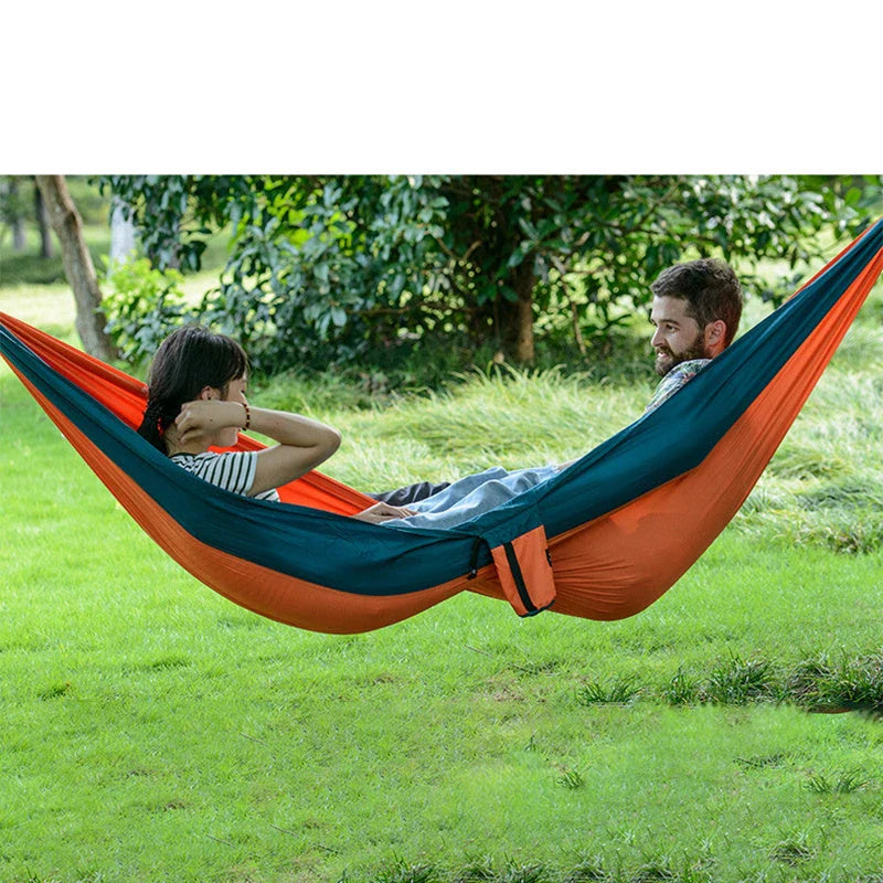 Premium double hammock made with soft, breathable fabric and reinforced ropes for outdoor use