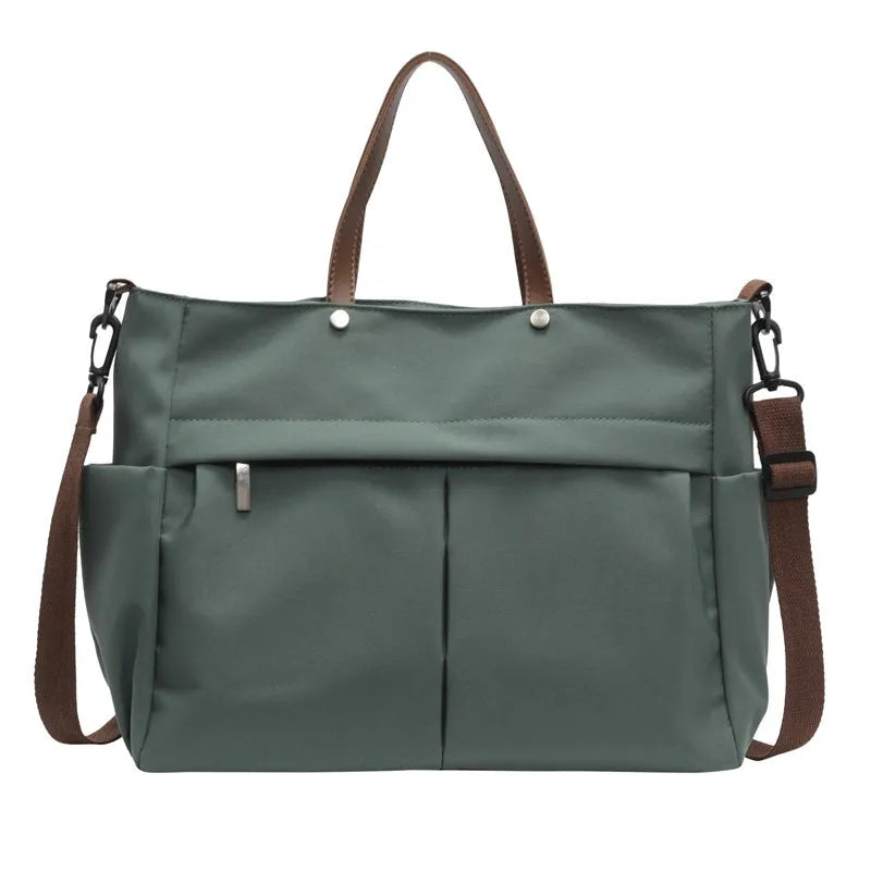 Nylon crossbody bag in five colours with 39x14x28cm dimensions and shoulder strap
