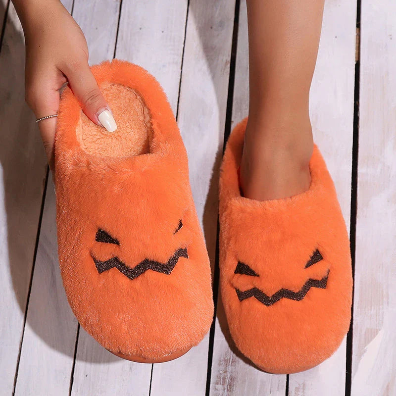 Cozy pumpkin-shaped slippers in orange color with plush fabric and non-slip sole for comfortable indoor wear