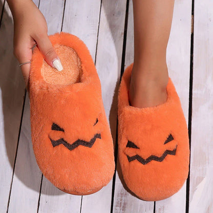 Cozy pumpkin-shaped slippers in orange color with plush fabric and non-slip sole for comfortable indoor wear