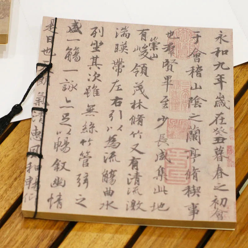 A5 antique wire-bound notebook with classical artwork cover, black oil wax rope binding, and decorative tassels