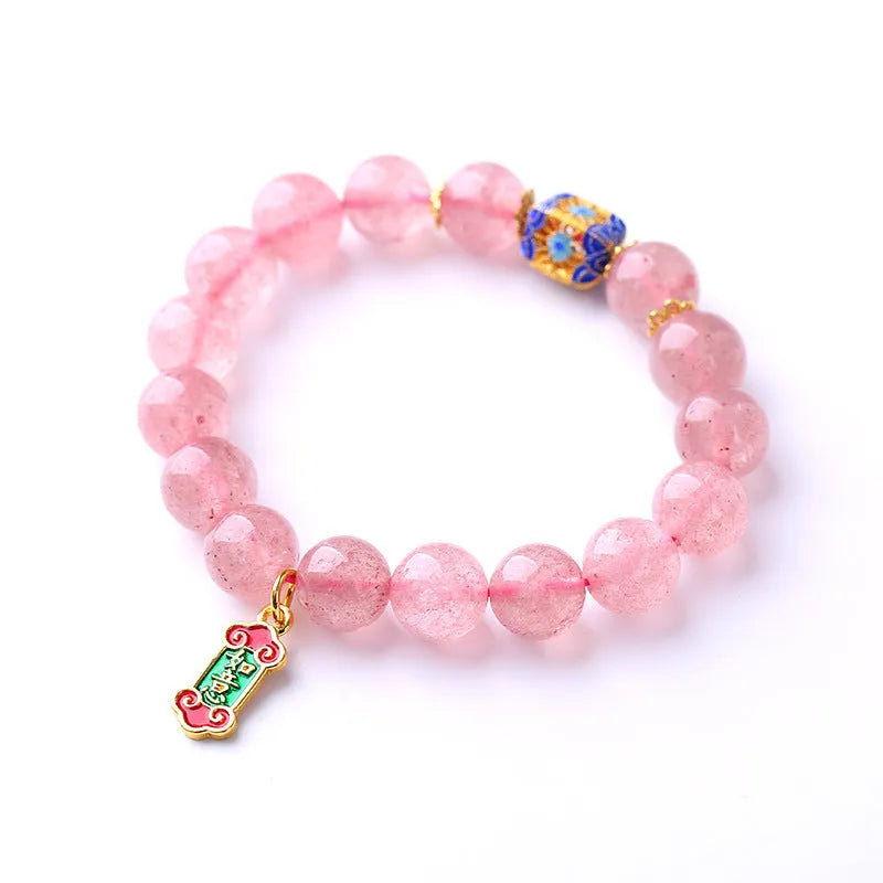 Pink crystal bracelet with Strawberry Quartz stones and Ruyi charm in hand-woven women's jewellery design