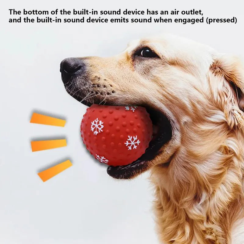 Red and green Christmas snowflake print dog chew ball with air vents, approx 7cm diameter.