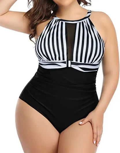 Women's black one-piece swimsuit with lace trim on display, showing front design and fabric detail.