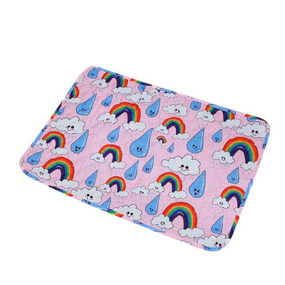 Reusable washable pet urine pad showing colourful animal pattern and waterproof backing.