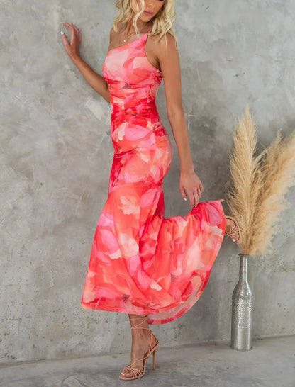 Elegant floral one-shoulder summer dress with suspender detail in vibrant colours