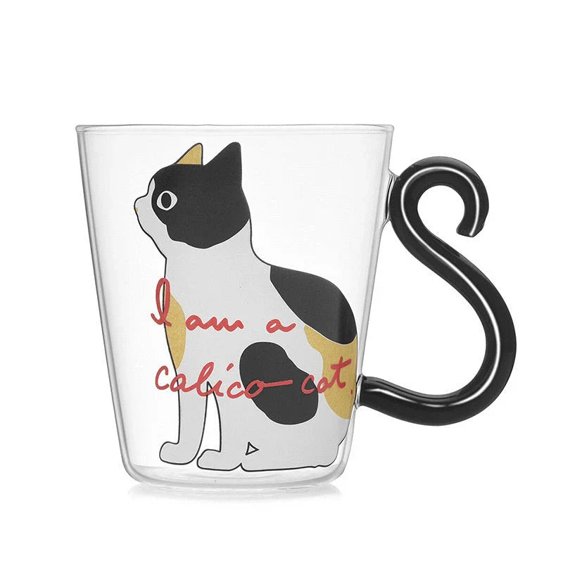 Adorable cat-themed glass mug with a whimsical cat-shaped handle, perfect for coffee, tea, and juice lovers